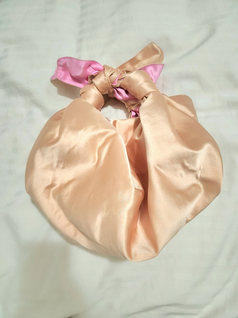 Peach Satin Knot-Handle Shoulder Bag with Pink Accent